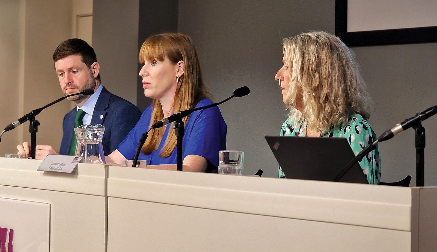 Photo of (l t r) Local Government Minister Jim McMahon, Deputy Prime Minister Angela Rayner, and LGA Chair Cllr Louise Gittins sitting together at a conference platform at LGA’s Smith Square offices
