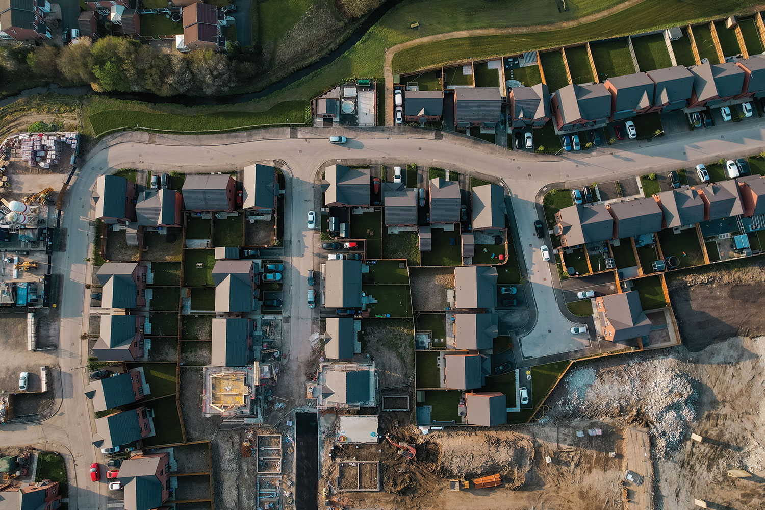 photo of aerial shot looking straight down onto a mixed and partially completed housing development