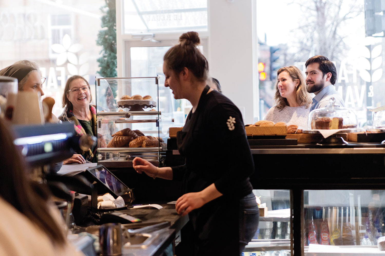 a woman working in a local coffee shop