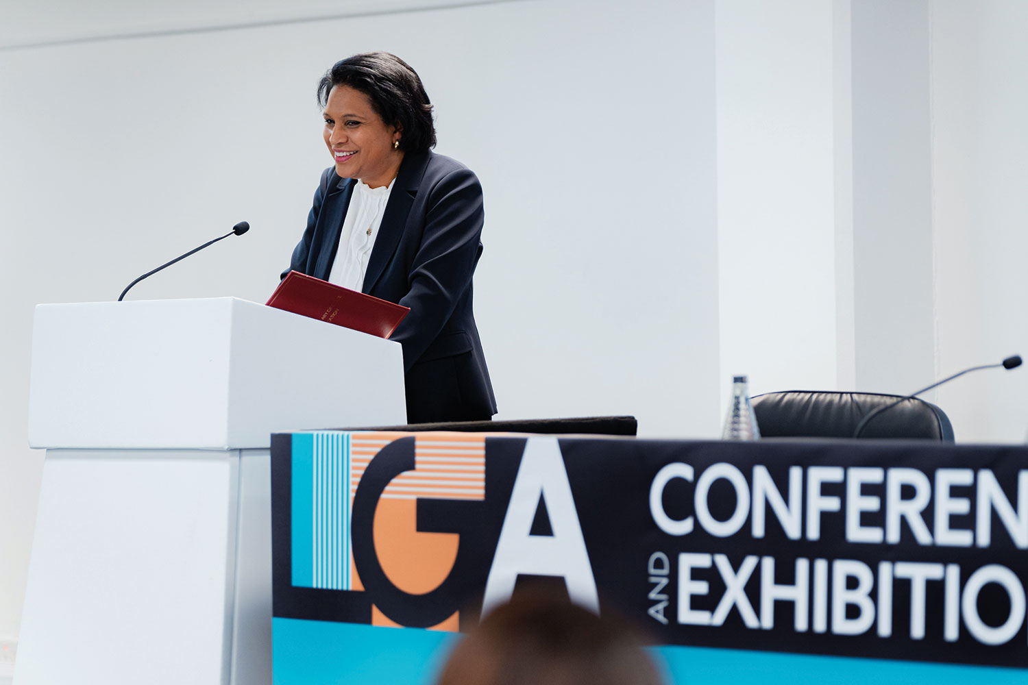 Children’s Minister Janet Daby standing up and smiling during her speech at LGA annual conference