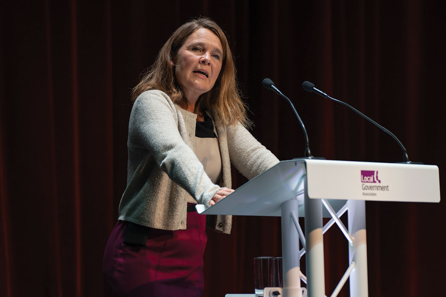 Cllr Vikki Slade MP, Liberal Democrat Spokesperson for Housing, Communities and Local Government, speaking from an LGA podium at annual conference.