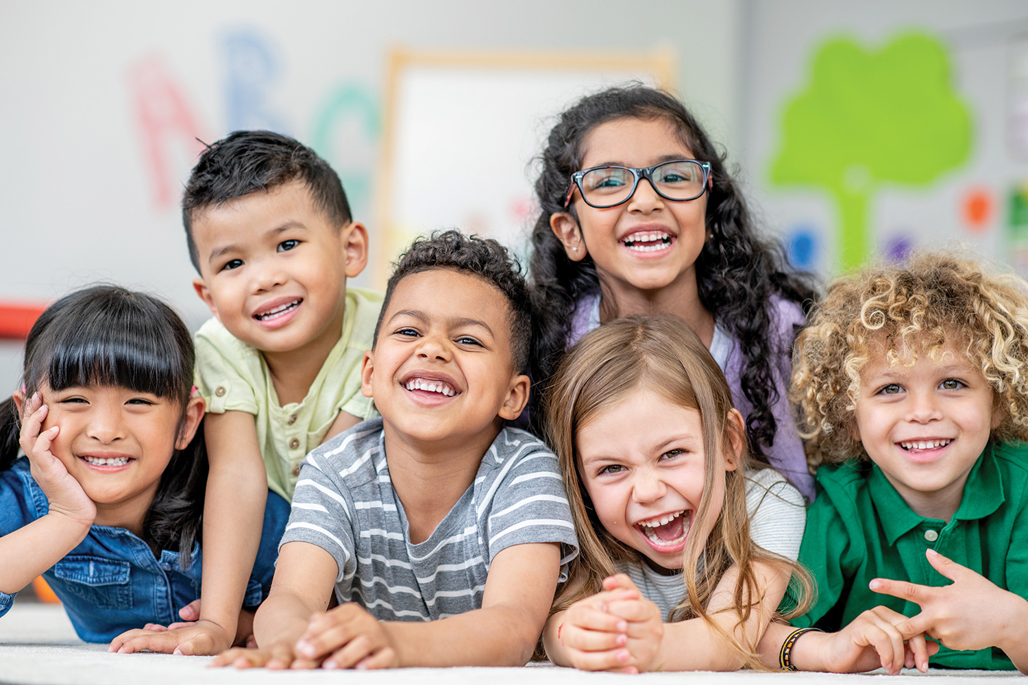 mixed group of cute kids smiling and laughing